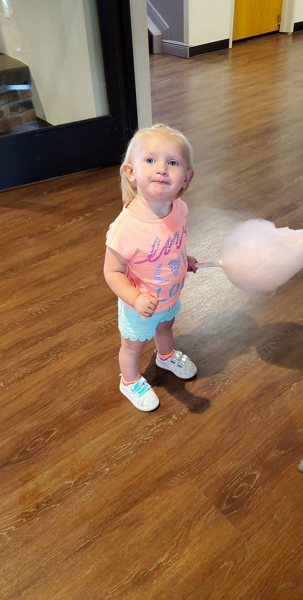 Andee is registered to the contest to win money with this photo: baby, cheek, child, floor, flooring, fun, hardwood, person, pink, play, skin, smile, standing, toddler, wood, wood_flooring