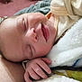 Oliver is registered to the contest to win money with this photo: baby, smiling, sleeping, blanket, hand, face, infant, clothing, cozy, comfort, closeup, skin, peaceful, child, portrait, cute, soft, indoors, newborn, resting
