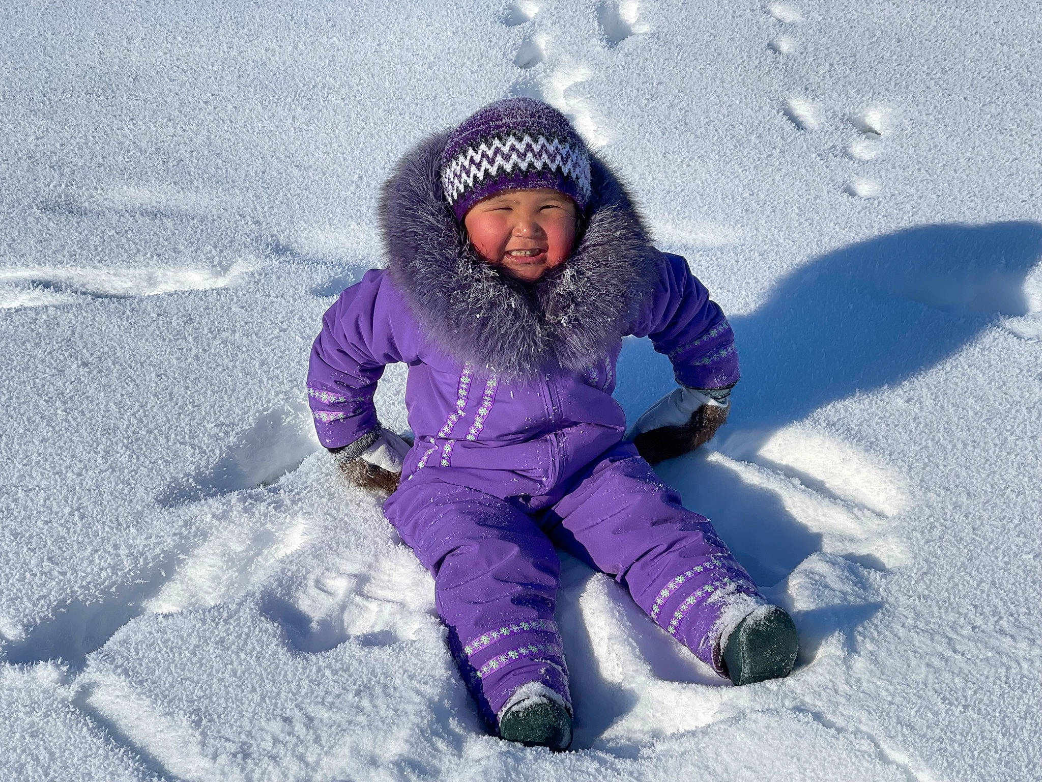 Jessica joined the competition — help win amazing prizes! child, electric_blue, freezing, fun, glove, happy, headwear, ice_cap, jacket, knit_cap, landscape, leisure, magenta, people_in_nature, person, purple, recreation, sitting, smile, snow