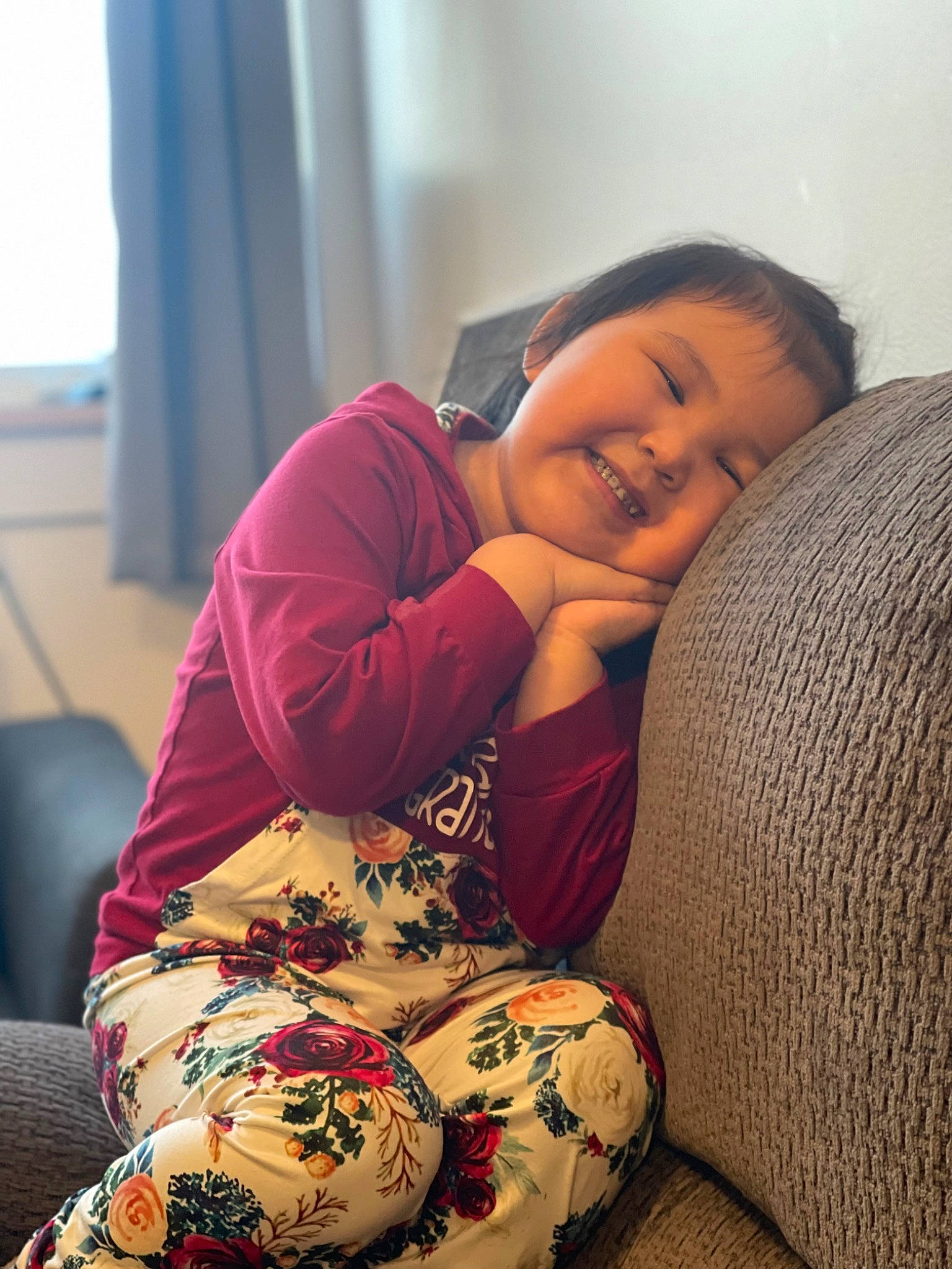 Jessica is registered to the contest to win money with this photo: black_hair, comfort, cool, face, facial_expression, finger, hairstyle, happy, human_body, human_leg, joint, joy, lap, leg, long_hair, person, shoulder, skin, sleeve, smile