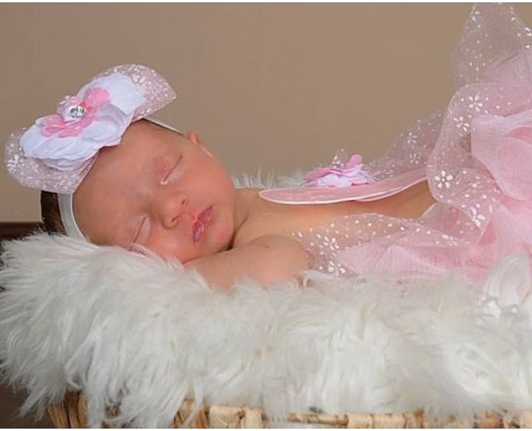 Kiara joined the competition — help win amazing prizes! baby, baby_toddler_clothing, bathing, bridal_accessory, cap, child, comfort, embellishment, event, fur, happy, hat, headband, headpiece, jewellery, linens, person, pink, skin, textile