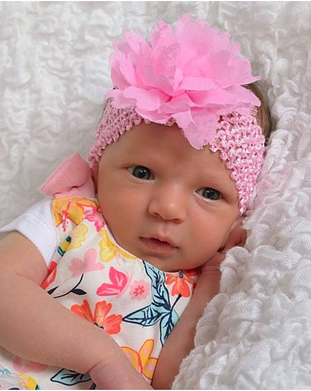 Kiara joined the competition — help win amazing prizes! baby, baby_toddler_clothing, cap, child, costume_hat, dress, eyelash, hair_accessory, happy, headband, headgear, headpiece, headwear, helmet, magenta, pattern, person, petal, pink, skin