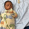 baby, sleeping, onesie, infant, blanket, pacifier, child, cute, peaceful, indoors, clothing, face, resting, soft, fabric, newborn, portrait, lying_down, toddler, cozy