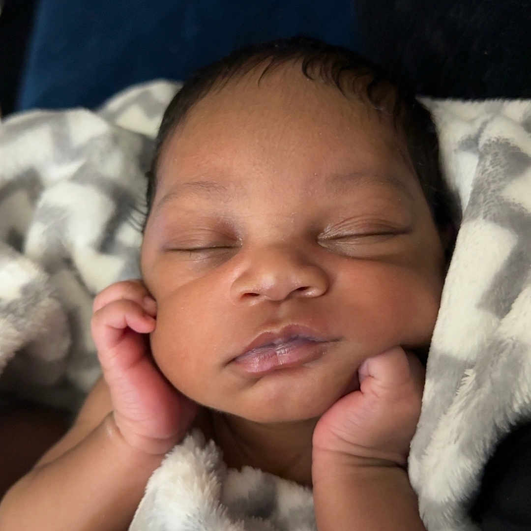 Kasai is registered to the contest to win money with this photo: baby, sleeping, blanket, cozy, infant, peaceful, hands, face, closed_eyes, soft, skin, cute, newborn, resting, warm, portrait, child, adorable, toddler, comfort