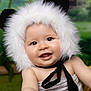 Côme a rejoint le concours — aidez-le/la à gagner de superbes lots ! baby, child, face, smiling, hood, fur, ears, black, white, cute, portrait, infant, happy, young, costume, animal_theme, outdoor_background, closeup, skin, expression