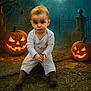 baby, child, halloween, pumpkin, jack_o_lantern, spider_web, spider, graveyard, grave, fog, night, costume, outdoor, scary, dark, tree, leaves, cobblestone, lantern, portrait
