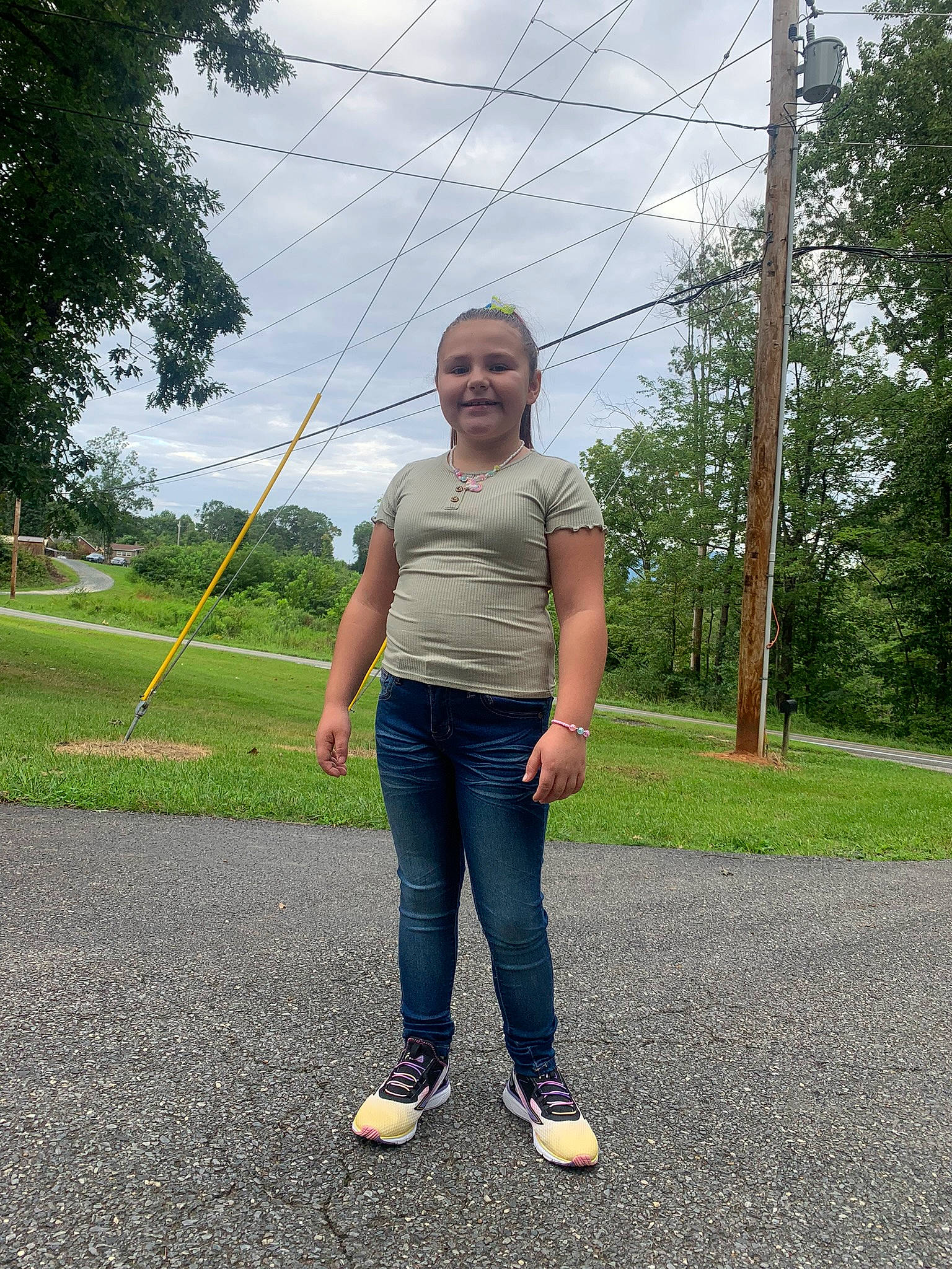 Ciara joined the competition — help win amazing prizes! asphalt, cloud, denim, electric_blue, fun, grass, grassland, happy, joy, landscape, leisure, people_in_nature, person, plant, pole, recreation, road, road_surface, sky, smile