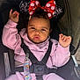 Evayah joined the competition — help win amazing prizes! toddler, child, stroller, pink_clothing, headband, minnie_mouse_ears, serious_expression, baby, seatbelt, outdoor, cute, face, portrait, person, young_child, black_hair, hands, sitting, clothing, sunlight