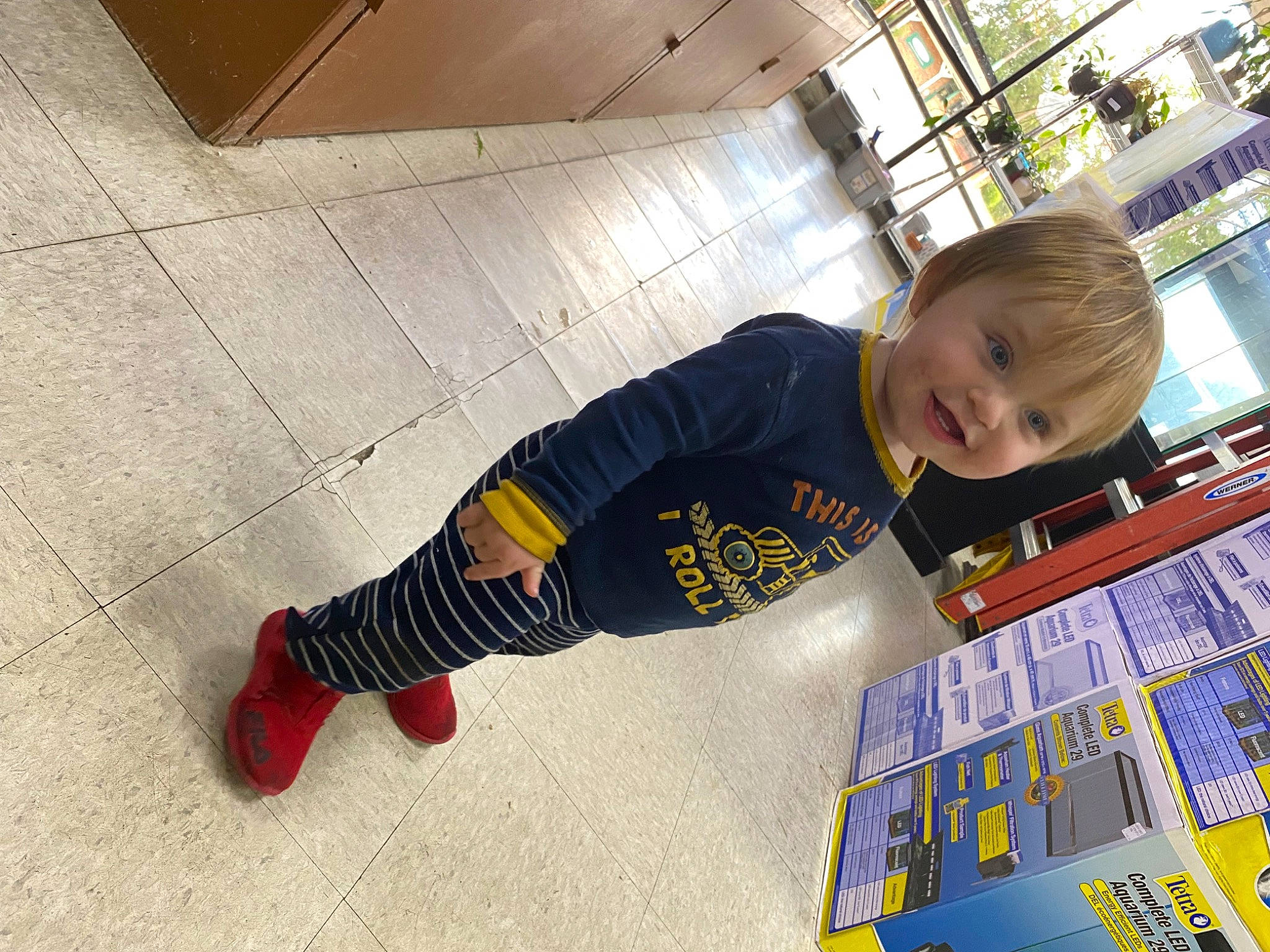 Gauge joined the competition — help win amazing prizes! asphalt, baby_toddler_clothing, child, concrete, floor, flooring, fun, hardwood, human_leg, knee, person, play, road_surface, room, sitting, t_shirt, toddler, wood