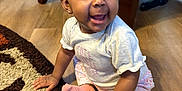 Waliyya joined the competition — help win amazing prizes! baby, child, smiling, headband, bow, socks, pants, shirt, floor, rug, wooden_floor, indoor, furniture, colorful_chair, happy, cute, person, portrait, seated, earrings