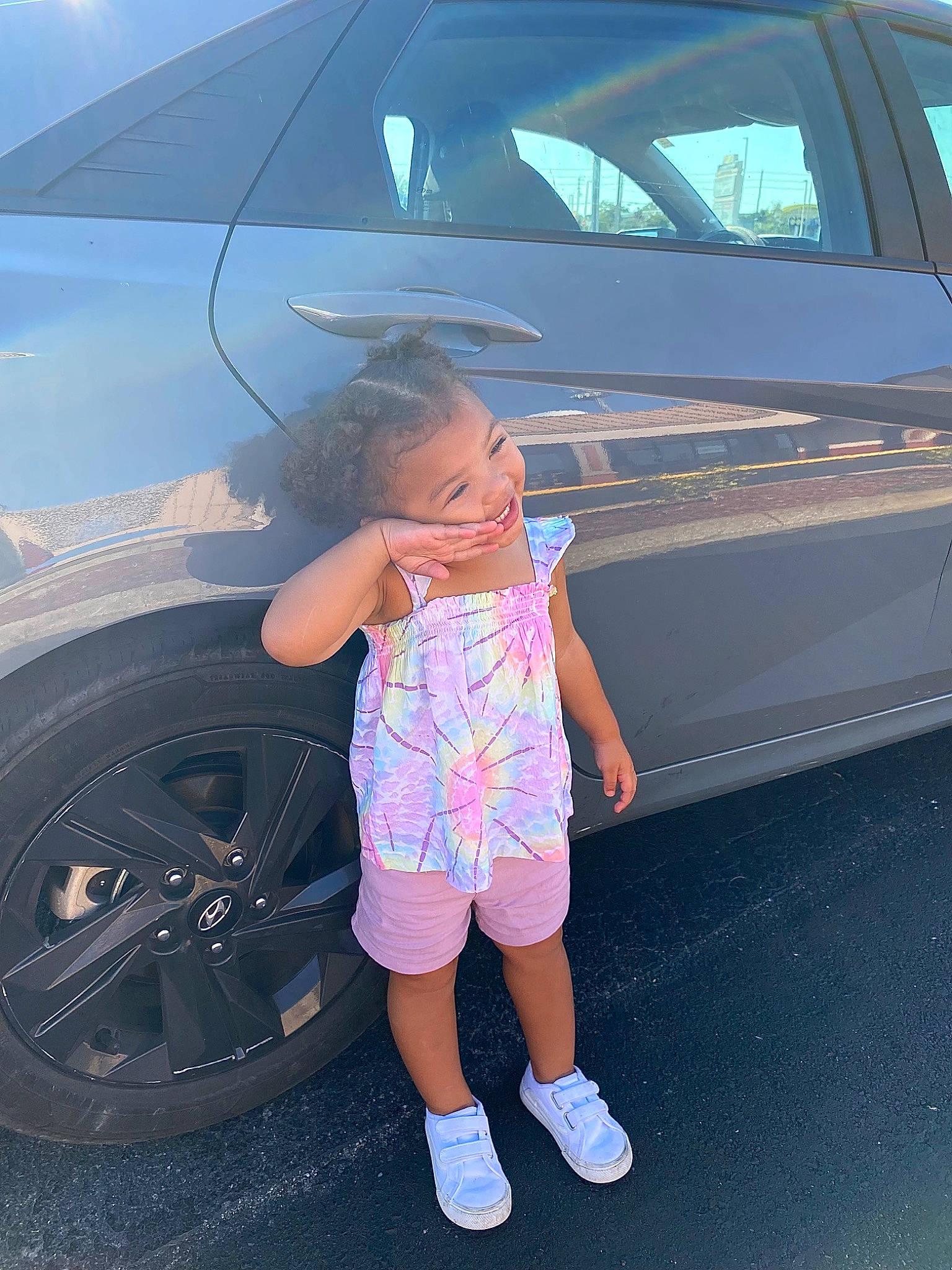 Arysaia joined the competition — help win amazing prizes! alloy_wheel, automotive_design, automotive_exterior, automotive_lighting, automotive_tire, blue, bumper, car, hood, jeans, land_vehicle, light, motor_vehicle, person, rim, shorts, tire, trunk, vehicle, vehicle_door