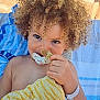 Jaron participe au concours pour gagner de l'argent avec cette photo : baby, child, curly_hair, cute, hand, happy, outdoor, pacifier, playful, plush_toy, portrait, relaxing, skin, smile, striped_toy, sunlight, toddler, towel, toy, yellow_toy