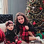 black_top, carpet, child, children, christmas_tree, cute, decorations, family, festive, gifts, happy, headband, holiday, indoor, plaid_dress, portrait, presents, red_socks, sitting, smiling