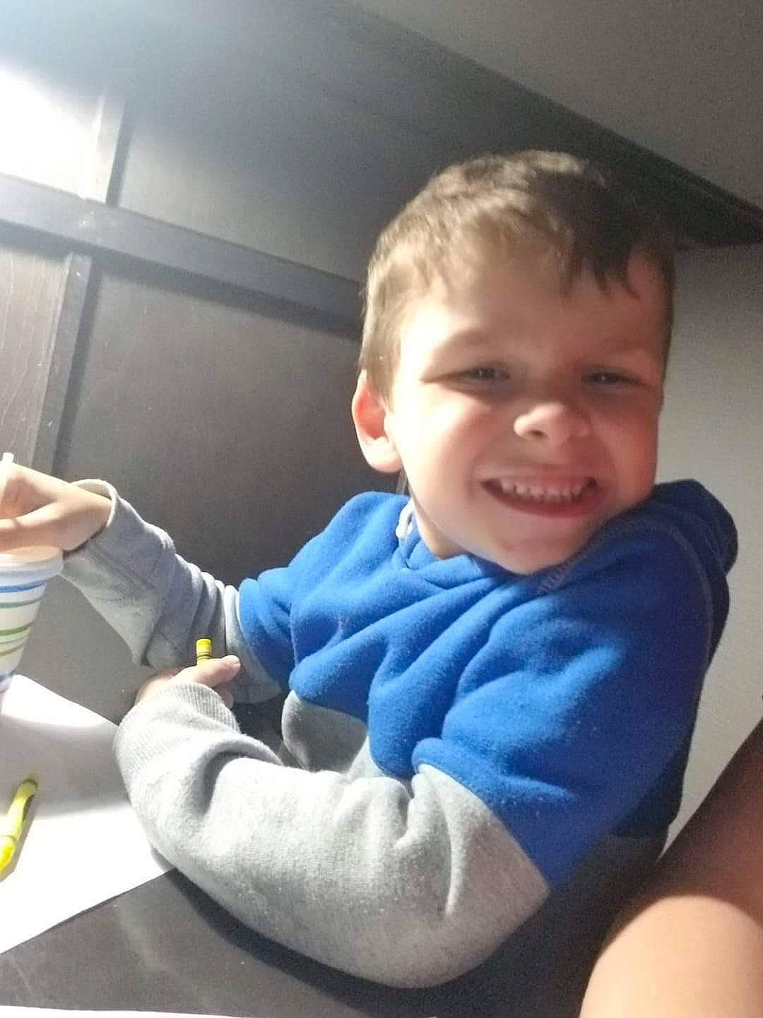 Jaxson is registered to the contest to win money with this photo: arm, baby, car, car_seat, cheek, child, cool, electronic_device, finger, hand, happy, joy, person, play, sitting, skin, sky, smile, toddler, vacation