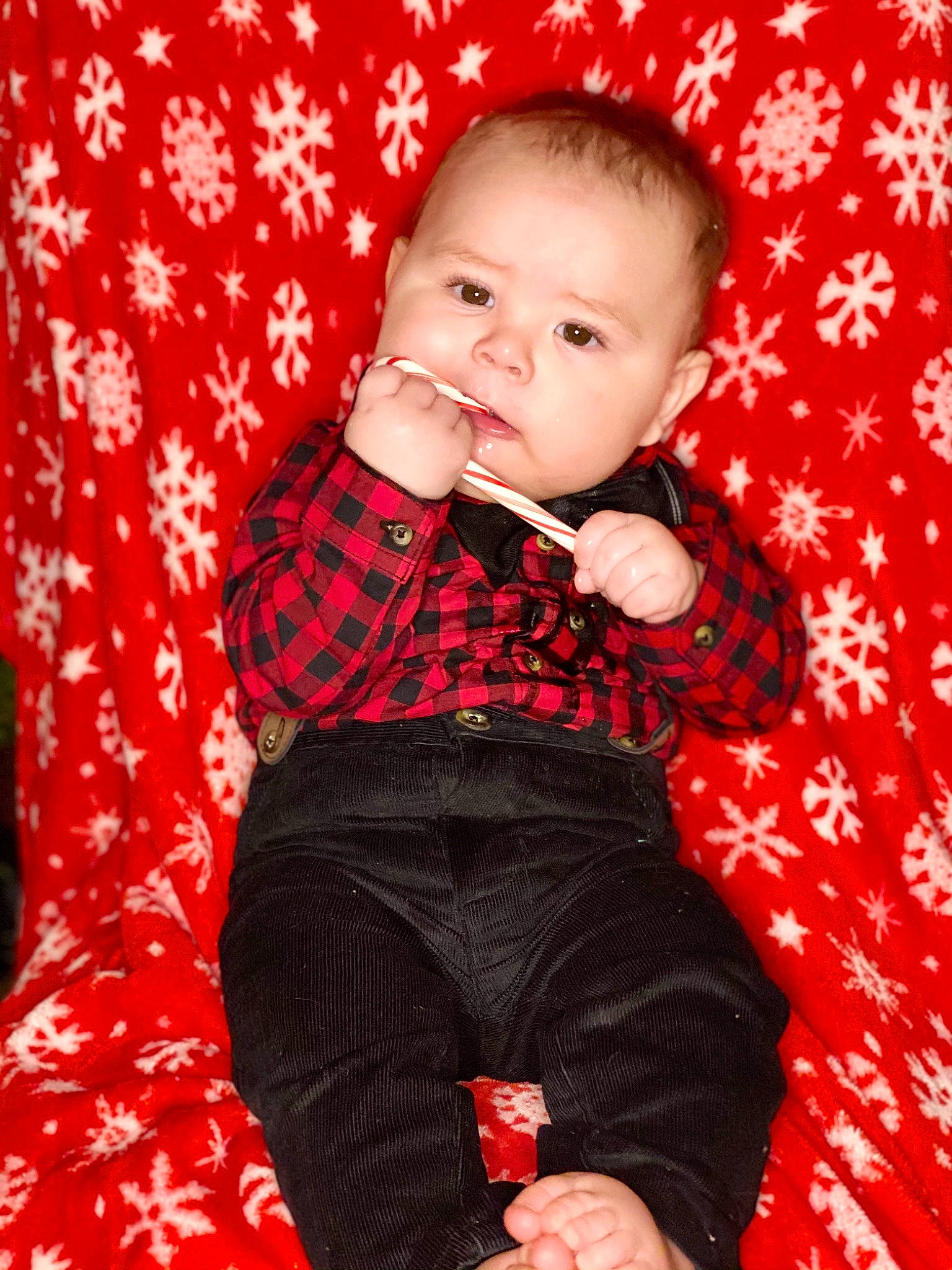Aydan is registered to the contest to win money with this photo: baby, baby_toddler_clothing, cheek, child, comfort, ear, finger, lap, lip, mouth, nail, nose, pattern, person, plaid, portrait_photography, red, sock, tartan, textile