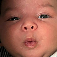 Sinan Ali joined the competition — help win amazing prizes! baby, face, closeup, expression, puckered_lips, skin, eyes, infant, cute, child, portrait, striped_blanket, mouth, nose, head, young, adorable, chubby_cheeks, human, person