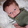 Alexander joined the competition — help win amazing prizes! baby, infant, face, eyes, clothing, green_outfit, striped_shirt, blanket, white_fur, basket, cute, portrait, skin, newborn, lying_down, baby_girl, baby_boy, soft_texture, closeup, adorable