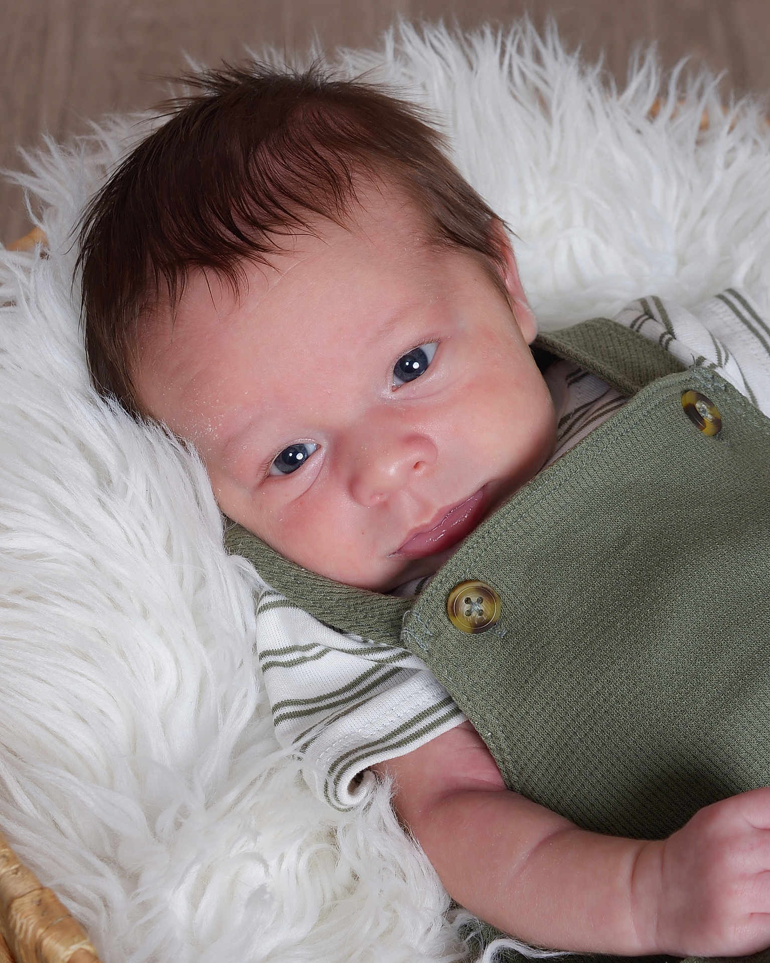 Alexander joined the competition — help win amazing prizes! baby, infant, face, eyes, clothing, green_outfit, striped_shirt, blanket, white_fur, basket, cute, portrait, skin, newborn, lying_down, baby_girl, baby_boy, soft_texture, closeup, adorable