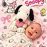 baby, blanket, bow, cartoon, child, close_up, dog_toy, flowers, happy, headband, hearts, indoor, infant, lying_down, pajamas, pink, plush_toy, portrait, smiling, snoopy