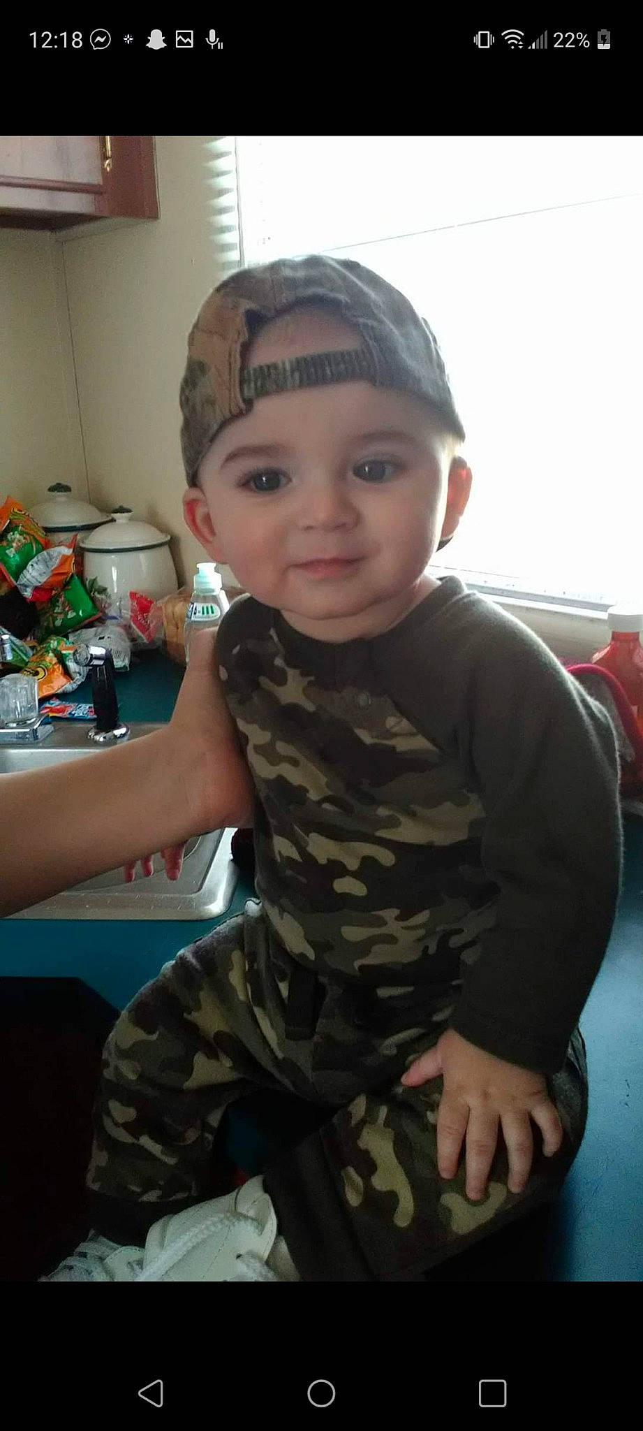 Mckinlee is registered to the contest to win money with this photo: camouflage, cap, cheek, eye, finger, forehead, fun, happy, head, headwear, military_camouflage, military_person, military_uniform, pattern, person, personal_protective_equipment, skin, sleeve, smile, t_shirt