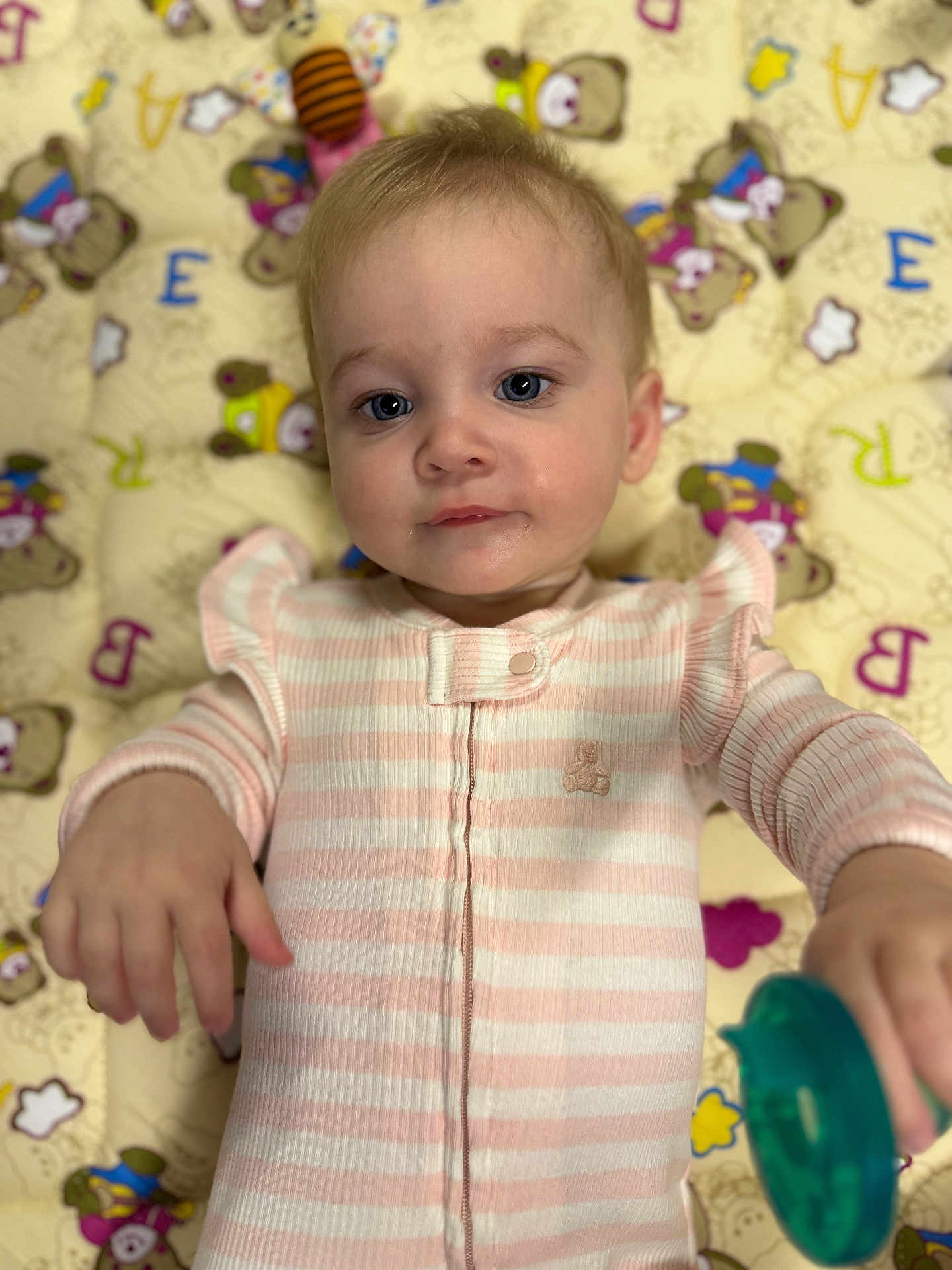 Elladee joined the competition — help win amazing prizes! baby, child, infant, onesie, pink, striped_clothing, pacifier, teddy_bear_pattern, playmat, cute, face, hand, blue_eyes, lying_down, soft_lighting, indoor, portrait, young_child, calm, curious