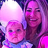 baby, child, woman, face, costume, ears, headpiece, blue_clothing, portrait, smile, purple_light, indoor, people, parent, childhood, person, happy, cute, event, celebration