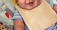 Kyaire is registered to the contest to win money with this photo: animal_print, baby, baby_seat, bib, cheerful, child, comfort, cute, giraffe, happy, indoor, infant, monkey, playful, plush, portrait, seat, smiling, striped_clothing, young