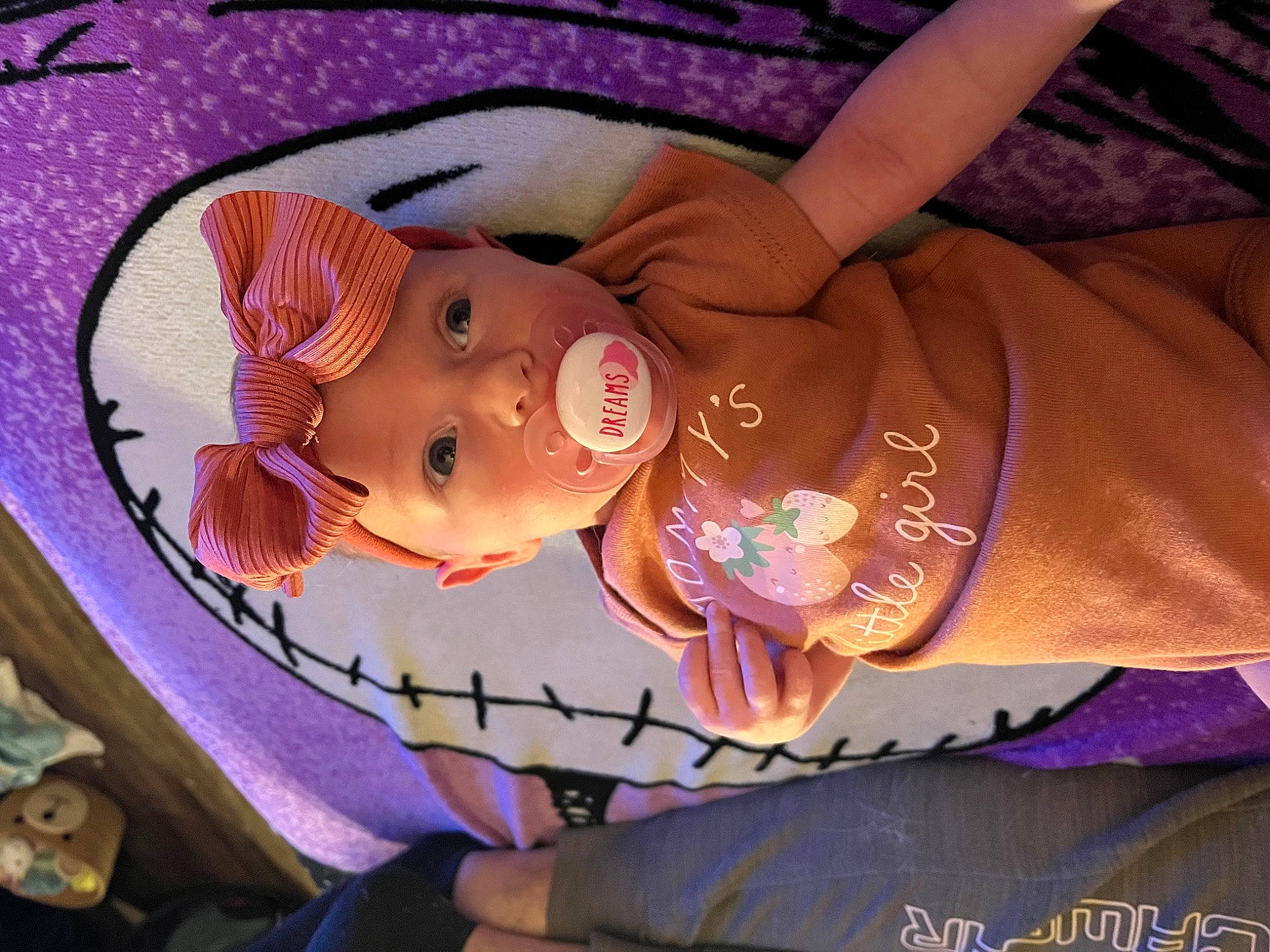 Annabelle is registered to the contest to win money with this photo: baby, baby_products, cheek, chest, child, elbow, event, eye, eyelash, head, headgear, headwear, lip, mouth, nail, pattern, person, pink, purple, skin
