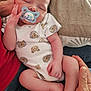 baby, blanket, child, comfort, couch, cute, family, feet, hand, indoor, infant, legs, love, onesie, pacifier, person, relaxation, resting, skin, sleeping