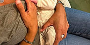Hayden participe au concours pour gagner de l'argent avec cette photo : baby, newborn, sleeping, infant, adult, hands, jeans, bracelet, ring, blanket, clothing, feet, comfort, indoor, skin, person, holding, rest, casual, love