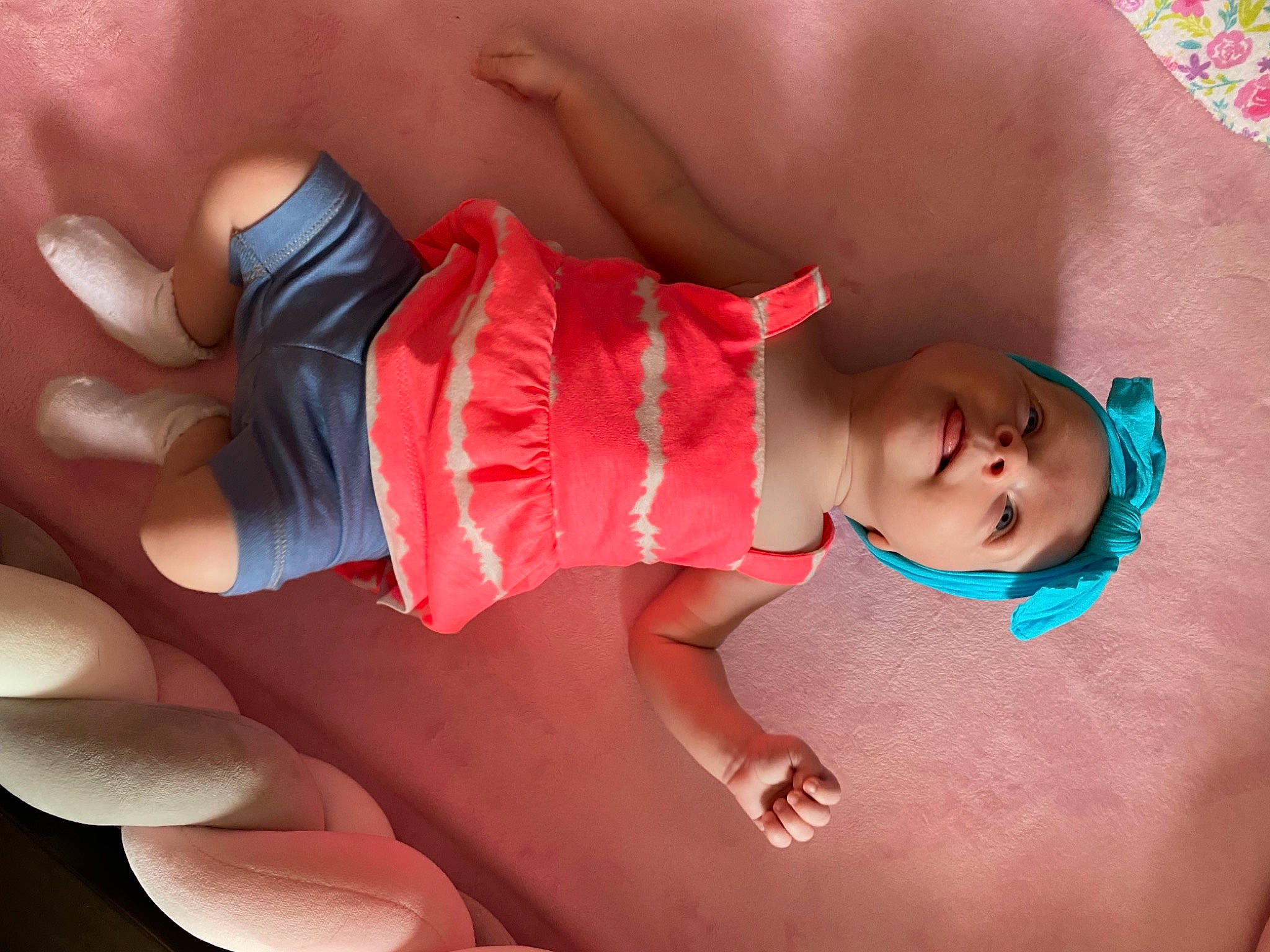 Dallis is registered to the contest to win money with this photo: arm, baby, baby_toddler_clothing, facial_expression, finger, fun, happy, headwear, human_body, joint, knee, leg, mouth, muscle, orange, person, pink, red, skin, thigh