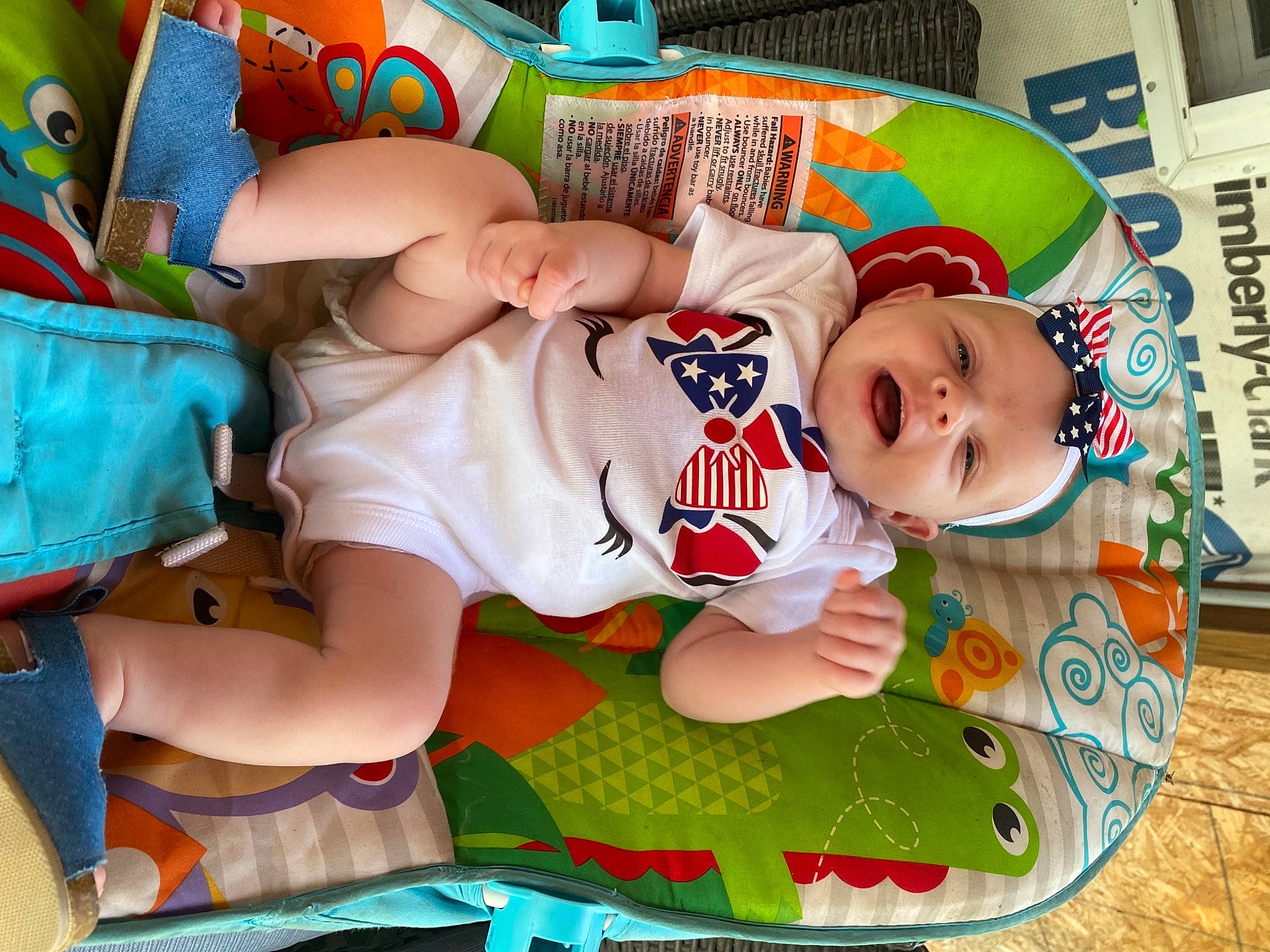 Dallis is registered to the contest to win money with this photo: baby, baby_products, baby_safety, baby_toddler_clothing, child, comfort, diaper, fun, green, lap, leg, linens, mouth, pattern, person, sleeve, sock, t_shirt, textile, thigh