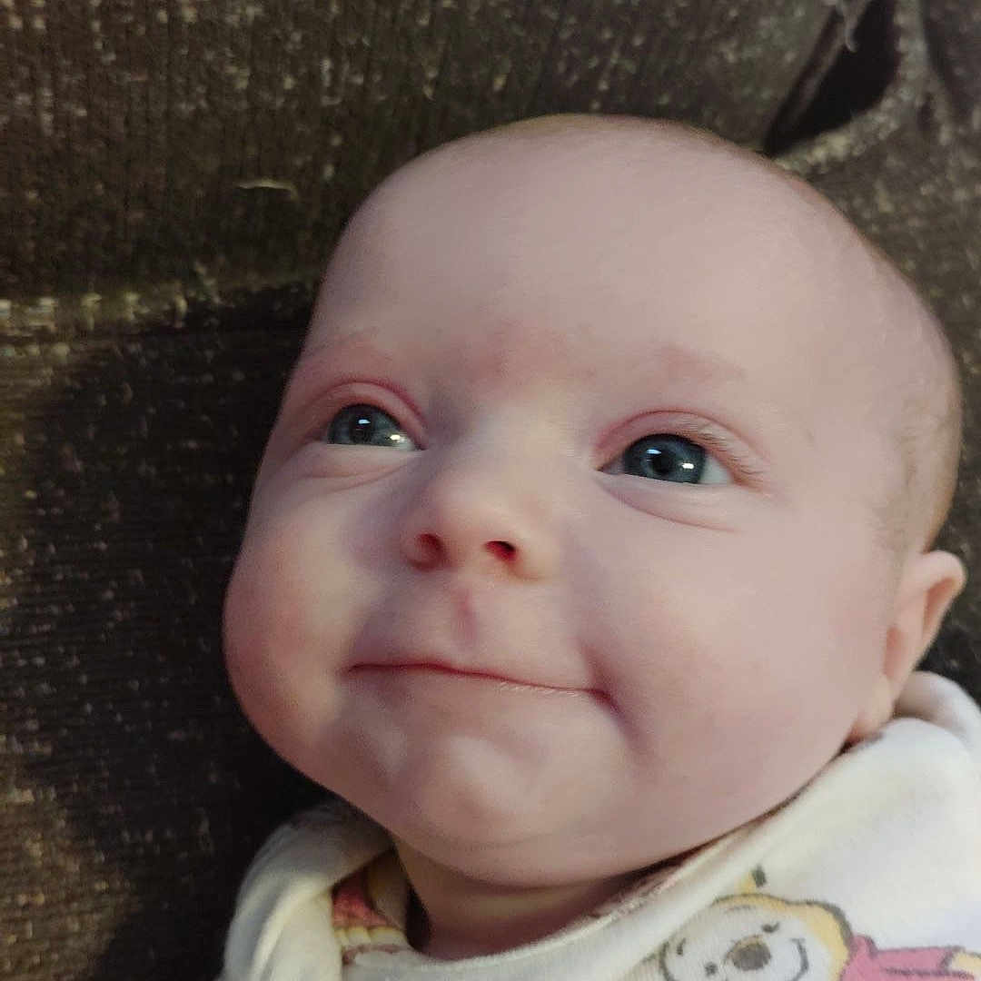 Ezra is registered to the contest to win money with this photo: accessories, baby, clothing, cushion, earring, face, happy, hat, head, homedecor, jewelry, laughing, newborn, person, photography, portrait, quilt, selfie, smile, t_shirt