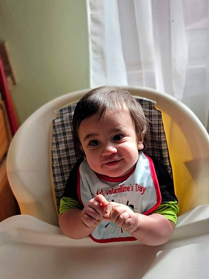 Titus joined the competition — help win amazing prizes! baby, baby_toddler_clothing, chair, child, comfort, eye, finger, fun, happy, human_leg, pattern, person, plaid, sitting, skin, smile, t_shirt, thigh, thumb, toddler