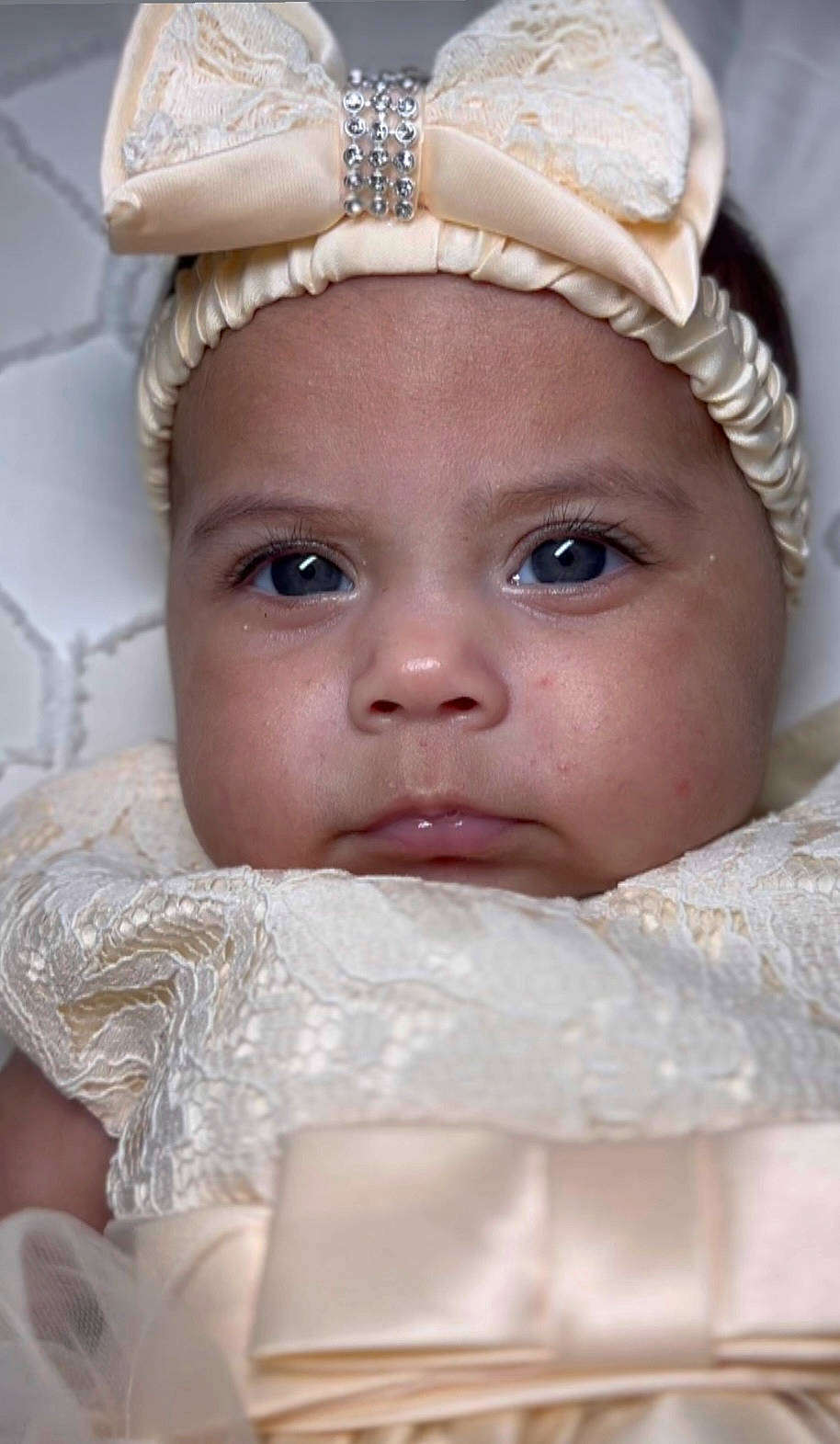 Camila is registered to the contest to win money with this photo: baby, baby_toddler_clothing, cheek, chin, eye, eyebrow, eyelash, happy, head, headgear, headpiece, headwear, iris, lip, mouth, nose, organ, person, skin, textile