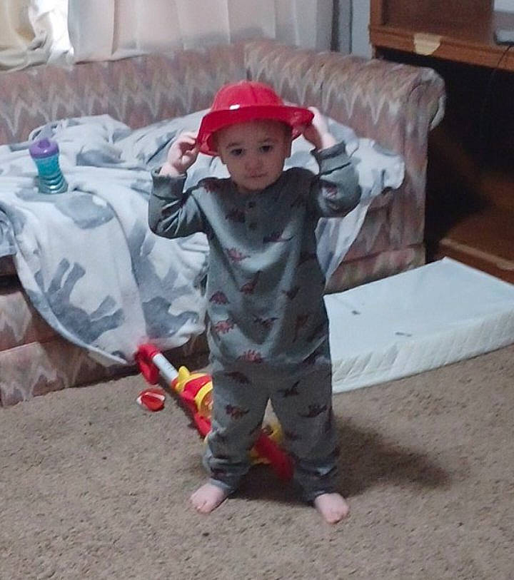 Jason joined the competition — help win amazing prizes! asphalt, baby, carmine, child, comfort, concrete, costume, couch, flooring, hardwood, hat, headwear, linens, person, personal_protective_equipment, plastic, play, sitting, table, toddler