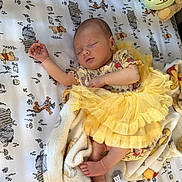 Zoey joined the competition — help win amazing prizes! baby, newborn, sleeping, yellow_tutu, blanket, winnie_the_pooh, tigger, cozy, soft, infant, child, cute, peaceful, resting, clothing, foot, hand, indoor, bed, nap