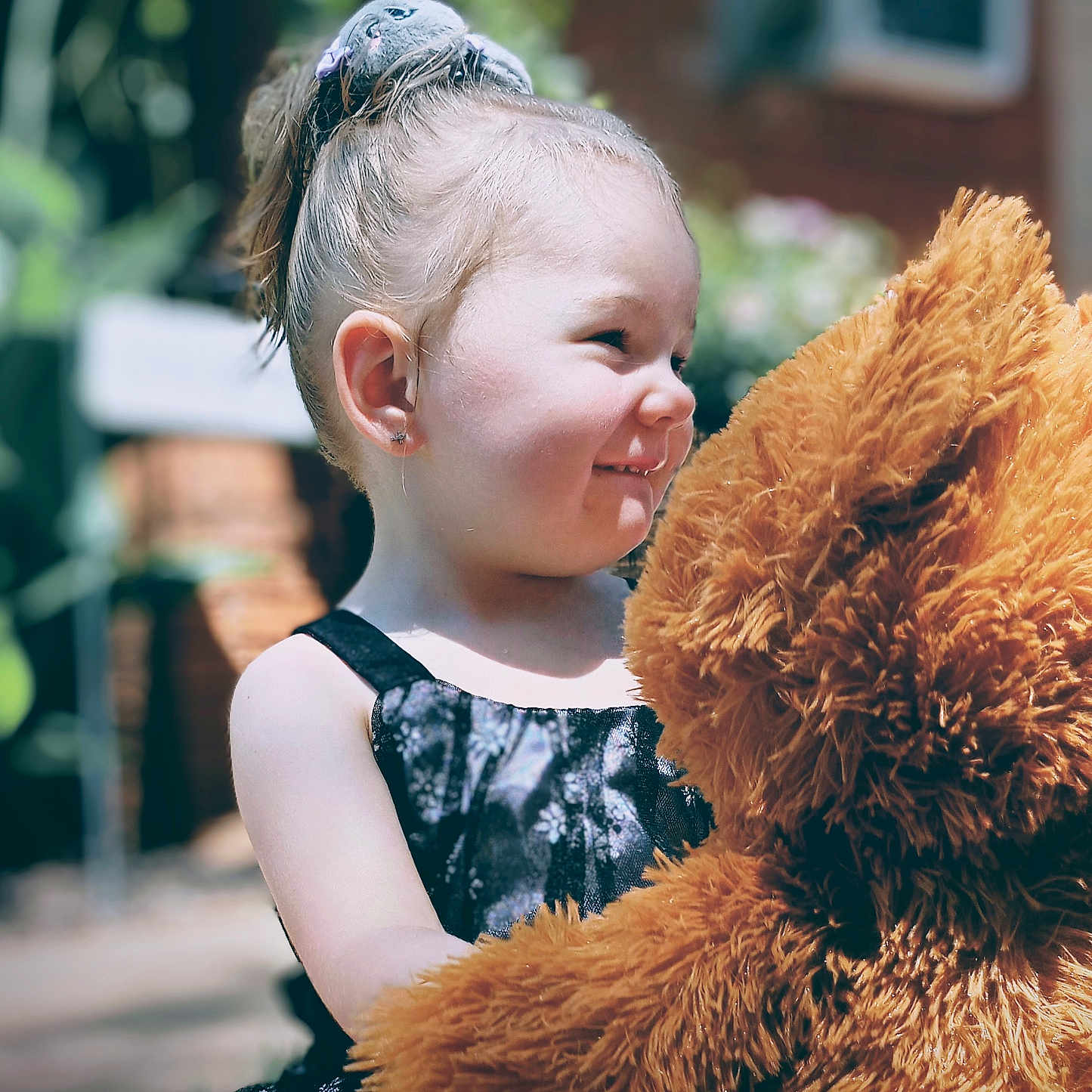 Lue Lue joined the competition — help win amazing prizes! black_dress, child, cute, daylight, garden, girl, hair_scrunchie, happy, nature, outdoor, person, playful, plush, pony_tail, portrait, smiling, sunlight, teddy_bear, toy, young