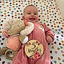 Layana participe au concours pour gagner de l'argent avec cette photo : baby, infant, smiling, pink_onesie, rainbow_patch, plush_toy, elephant_toy, milestone_sticker, 5_months, heart_pattern, blanket, cute, lying_down, child, happy, soft_toy, indoors, portrait, cozy, colorful