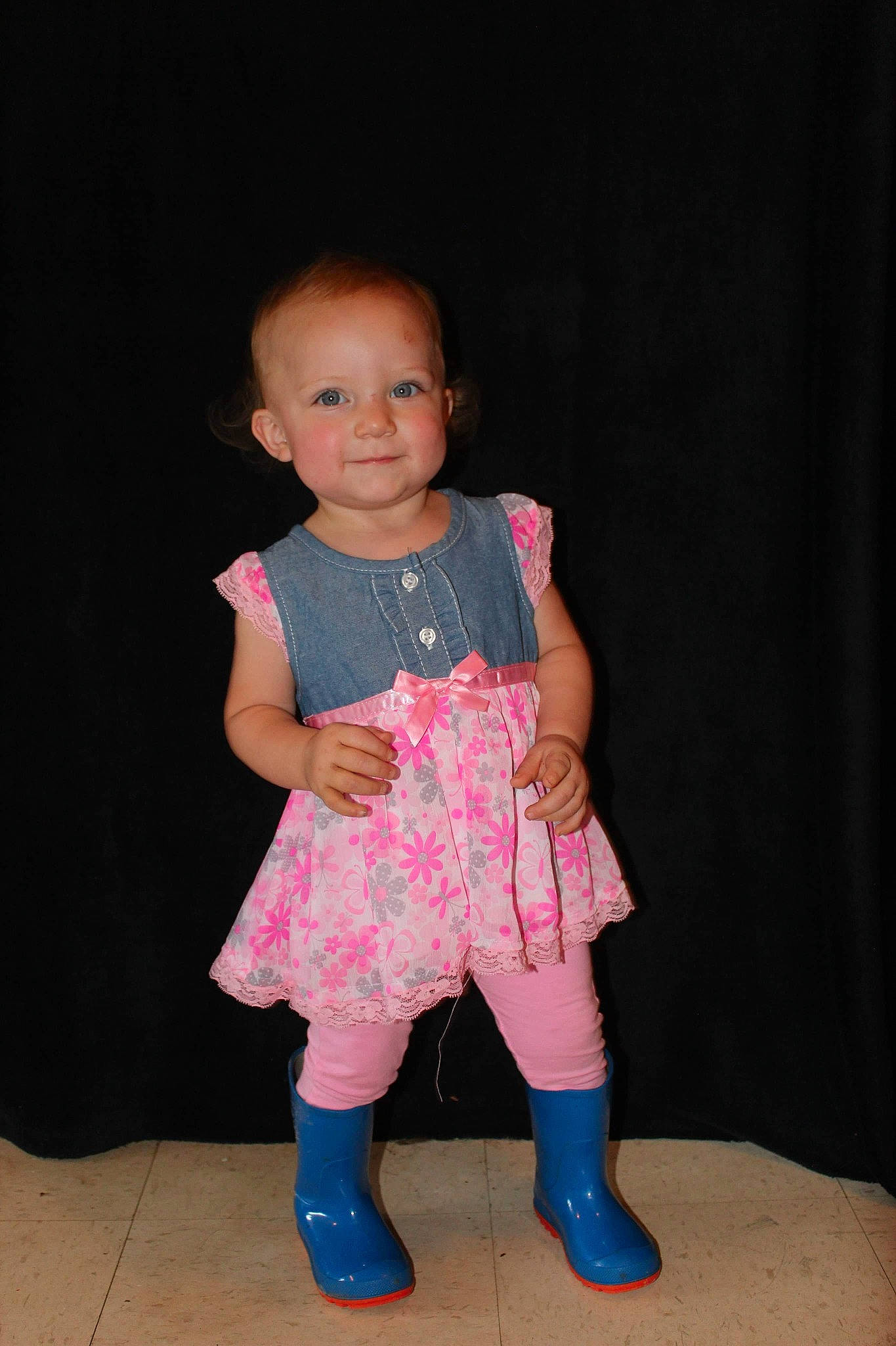 Jazmine is registered to the contest to win money with this photo: arm, baby, child, costume, dress, footwear, fun, joy, knee, person, pink, shoe, sitting, skin, smile, standing, tights, toddler