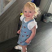 Ruby-Ann joined the competition — help win amazing prizes! toddler, child, indoor, smiling, blonde_hair, denim_dress, sandals, socks, staircase, carpet, floor, wood_floor, happy, person, cute, young_child, home, casual_clothing, portrait, standing
