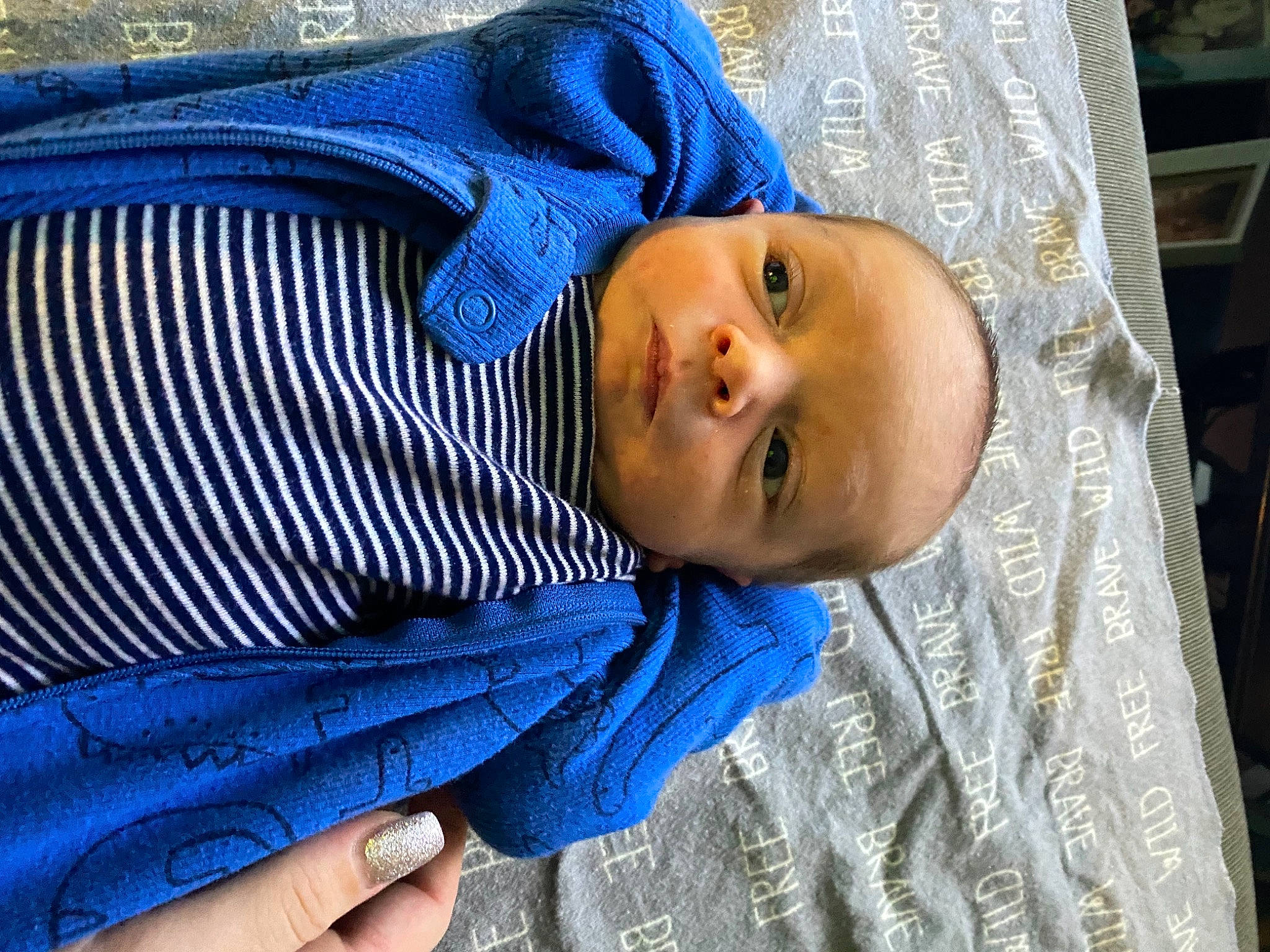 Oliver is registered to the contest to win money with this photo: baby, blue, cheek, child, comfort, denim, electric_blue, eyebrow, headgear, iris, linens, nail, nose, pattern, person, sitting, skin, sleeve, smile, textile