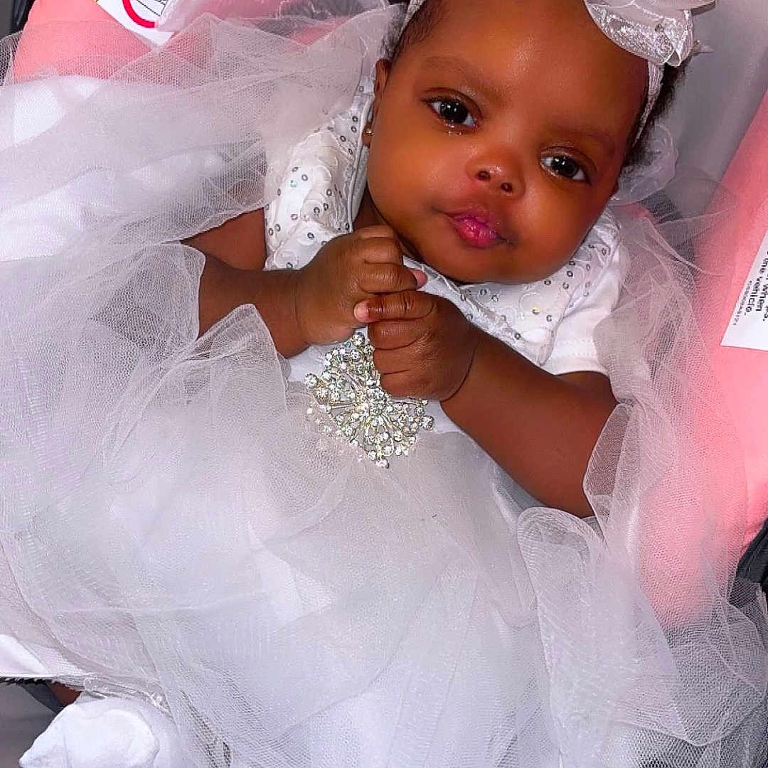 Denim is registered to the contest to win money with this photo: accessories, baby, bonnet, bracelet, clothing, cushion, dress, face, fashion, formalwear, gown, hat, head, homedecor, jewelry, necklace, person, photography, portrait, tape