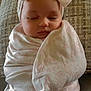 Taylor is registered to the contest to win money with this photo: baby, sleeping, blanket, bow, headband, couch, wrapped, soft, infant, cute, peaceful, face, child, indoors, cozy, portrait, resting, toddler, clothing, furniture