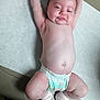 Berkley is registered to the contest to win money with this photo: baby, infant, diaper, socks, medical_table, examination_room, arms_up, smile, tousled_hair, skin, chubby, lying_down, person, head, legs, feet, cute, child, healthcare, indoors