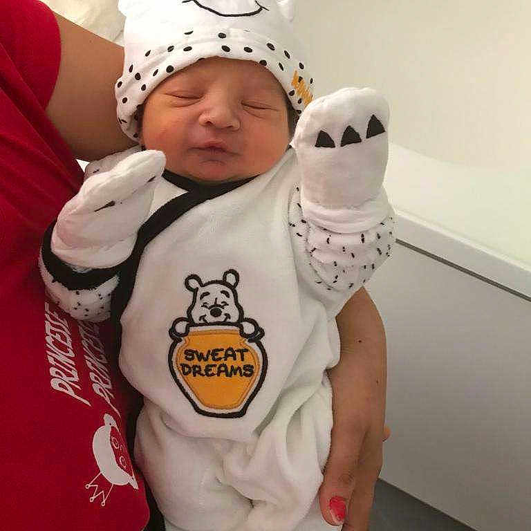 Skaylheur participe au concours pour gagner de l'argent avec cette photo : adult_hand, baby, baby_outfit, bear_hat, cozy, cute, holding, indoor, infant, mittens, newborn, nursery, person, portrait, pout, red_shirt, sleeping, sleepwear, soft_toys, white_clothing