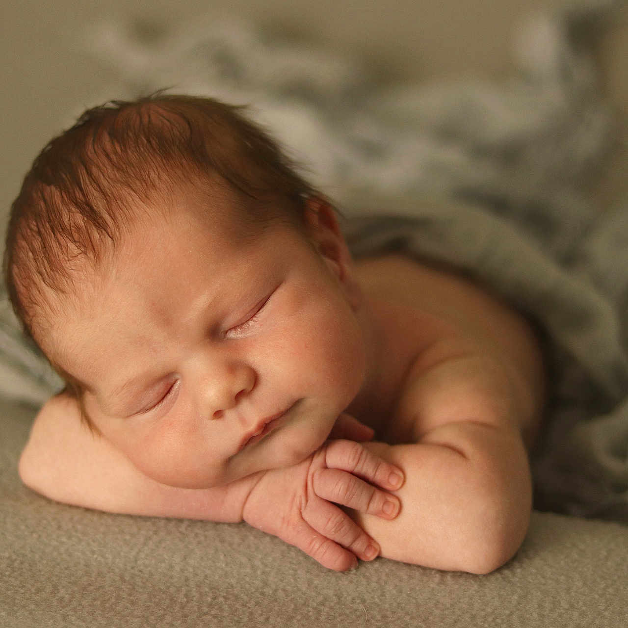 Kieran is registered to the contest to win money with this photo: baby, blanket, bodypart, face, finger, hand, head, newborn, person, photography, portrait, sleeping