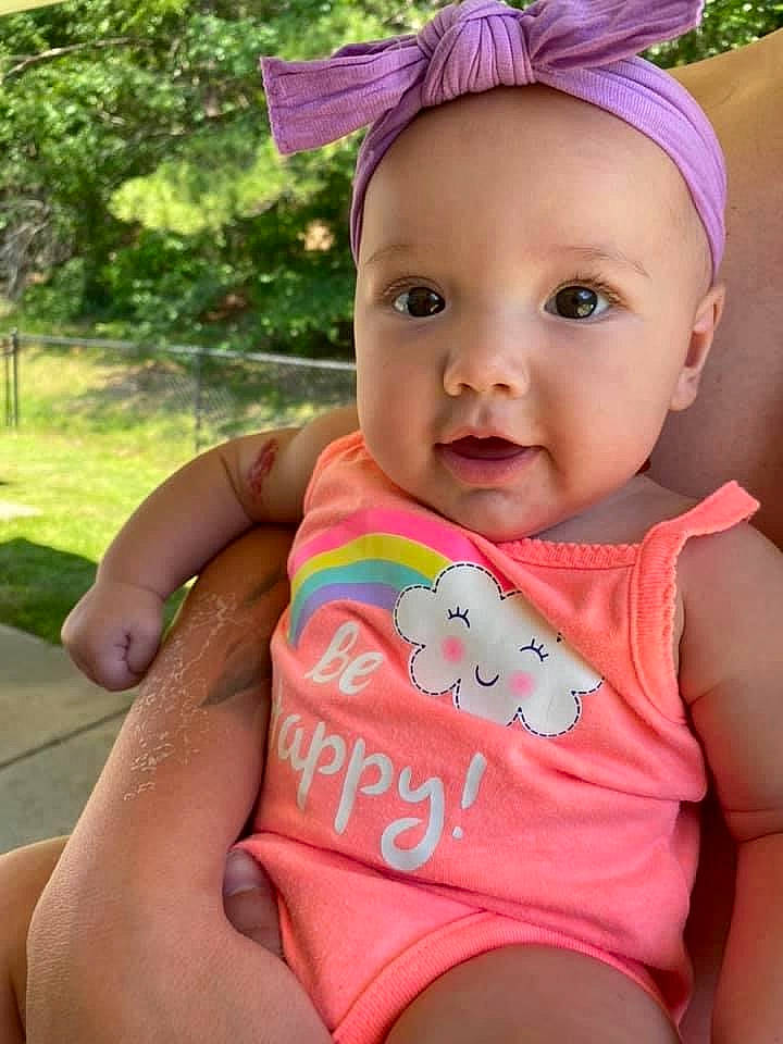 Fallon is registered to the contest to win money with this photo: baby, baby_products, baby_toddler_clothing, cheek, child, diaper, headgear, neck, person, pink, play, skin, smile, summer, toddler, vacation