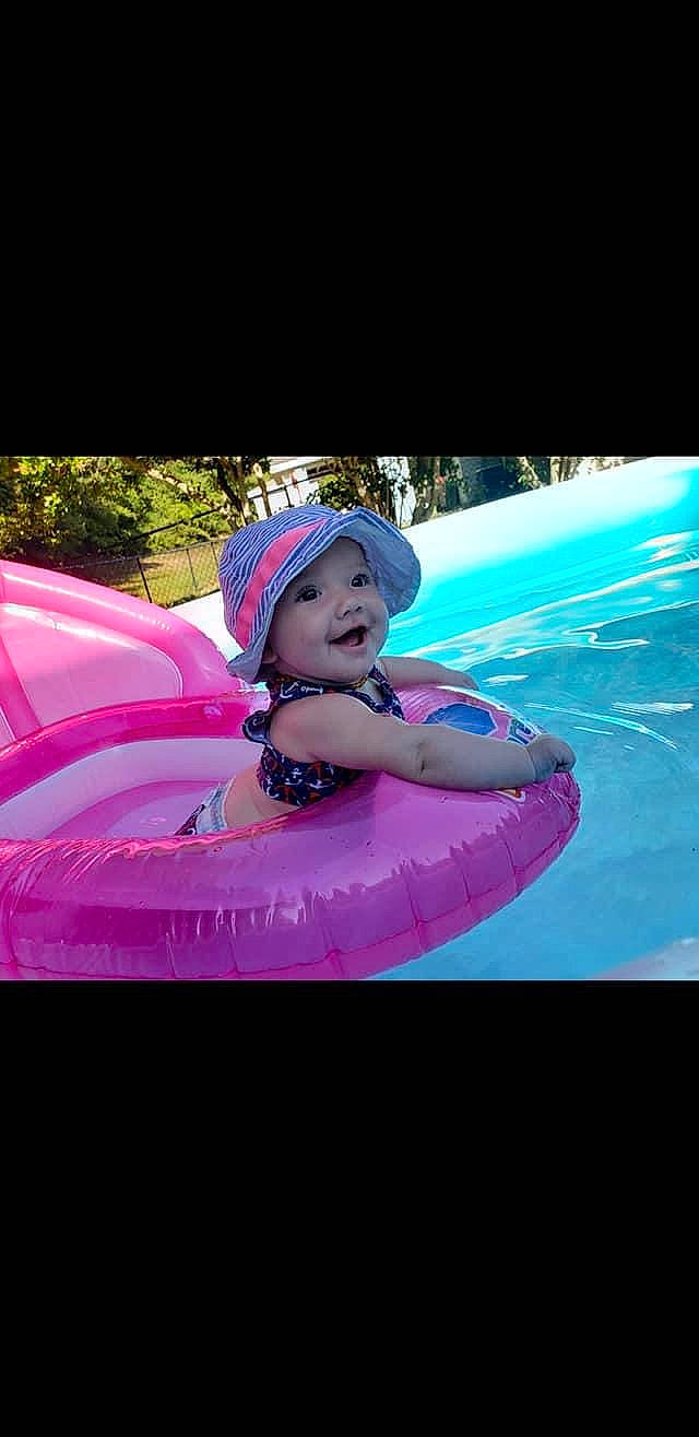Fallon joined the competition — help win amazing prizes! fun, games, headgear, headwear, inflatable, leisure, magenta, person, personal_protective_equipment, pink, recreation, smile, summer, swimming_pool, vacation