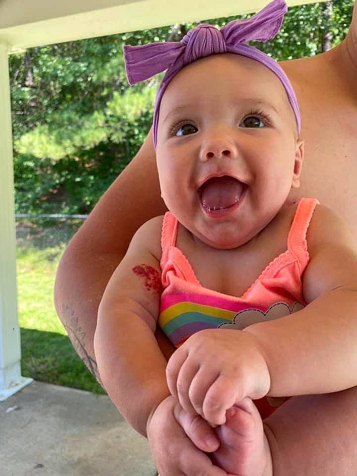 Fallon joined the competition — help win amazing prizes! baby, child, finger, hand, headgear, headwear, neck, person, play, skin, smile, thumb, toddler